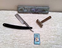 Wide view showing all items including the Gillette safety razor, Gillette Blue Blades pack and Pyramid Brand straight razor with box.