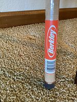 Brand label on cork handle with barcode showing brand name Berkley.