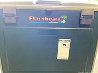 Closed green Flambeau Adventurer fishing tackle box with latches and logo