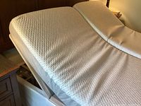 Split king mattresses on adjustable base with one side elevated