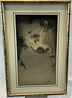 Full front view of framed print on easel