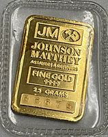 Close-up of front face showing JM logo, assay markings, purity and weight