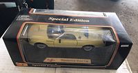 Photo of the special edition Maisto Thunderbird Show Car in original box showing the yellow car through clear display window.