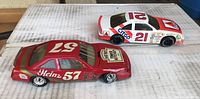 Side view showing Heinz #57 and Dale Jarrett #21 CITGO racing cars with branding and numbers.