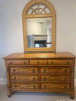 Front view of dresser with matching mirror mounted above it