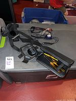 GoPro dog strap harness with mount and two headbands on gray surface