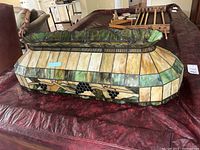 Front view of stained glass billiard light fixture showing grapevine design.