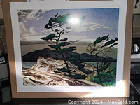Full view of the AJ Casson print showing the stylized pine trees and landscape in natural earthy colors.