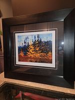 Framed fine art print by Tom Thomson featuring tamarack trees in fall colors.
