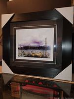 Front view of the professionally framed artwork with protective corner guards in place.