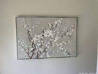 Floral canvas wall art with white flowers and brown branches on gray background
