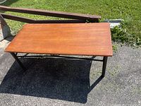 View of rectangular wooden top surface showing the color and minor wear.