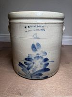 Full frontal view of crock showing maker stamp and cobalt decoration.