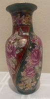 Front view of Andrea by Sadek floral vase showing floral design and gold accents on the body.