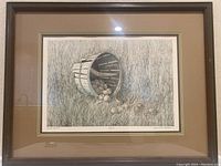 Framed lithograph showing the full artwork within the wooden frame and matte