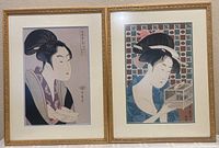Two framed Japanese woodblock prints by Kitagawa Utamaro side-by-side showing both artworks fully framed.
