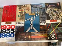 Top-down view of nine Fortune magazines arranged on a surface, showcasing colorful and graphic covers from 1945 to 1965.
