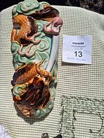 Front angle showing overall dragon design and vase shape with auction label.