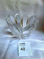 Full view of Orrefors Mayflower crystal bowl showing flower petal design and clear crystal transparency.