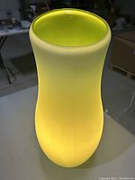 Light green glass table lamp top view showing the smooth curved opening and color gradient.