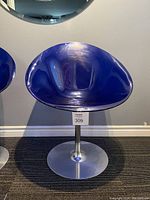 Front view of blue Eros swivel chair on aluminum tulip base, showing seat and base