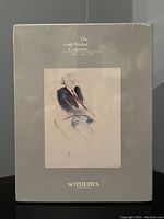 Front view of sealed box for 'The Andy Warhol Collection' 6-volume set with sketch art and Sotheby's branding.