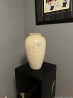 Full view of the vintage ceramic Princess House Heritage butter-cream cased glass vase showing overall shape and floral decoration.