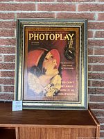 Framed vintage Photoplay Magazine cover of Norma Talmadge, closer view showing details in frame and magazine cover art.