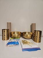 Full set showing metal bowls, utensil holders, cup stacks, forks, napkins, cake topper