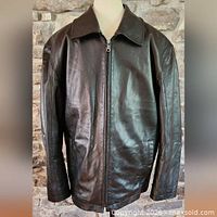 Front view of black leather jacket buttoned