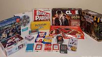 Group shot showing all board games, puzzles, card decks