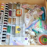Drawer overview showing gels, sprinkles, icing tube, bags, tips, couplers, cookie cutters, extruder and other items