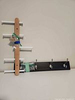 Both wall racks side by side showing full view and packaged hardware
