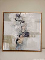 Front view of the framed 40" square abstract canvas painting