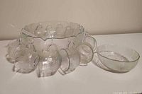 full set showing punch bowl with cups, hooks, ladle and extra bowl
