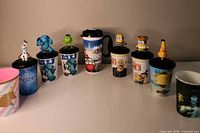 Front view of all cups showing character tops and graphics