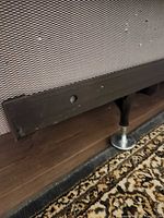 Close-up of metal side rail and support foot