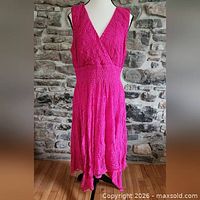 Full view of pink sleeveless lace dress on mannequin