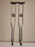 Full view of both crutches showing overall condition and components