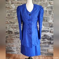 Front view of jacket and skirt set on mannequin