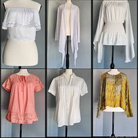 Six tops displayed on mannequins, front view