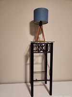 Full view of plant stand with lamp placed on top