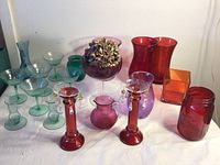Wide view of the entire glass collection showing arrangement and colors