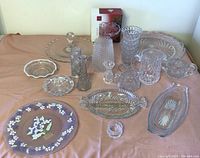 Photo of all vintage crystal and cut glass dishes with painted glass plate showing variety and arrangement.