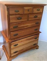 Full front view of two-piece highboy dresser showing overall style and condition