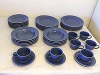 Overview of all dishes in the set showing plates, bowls, cups, and saucers in blue Cornflower pattern by Williams Sonoma.