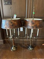 Overall view of both lamps showing design, shade style and height relative to surroundings