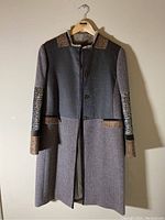 Front view of grey ETRO Milano coat with tweed and leather accents