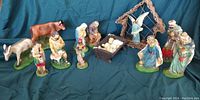 Full view of all chalkware Nativity figures including animals, shepherds, Wise Men, Mary, Joseph, baby Jesus, and angel stable.