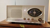 Front view of vintage Channel Master radio showing dial, knobs, and speaker grille.